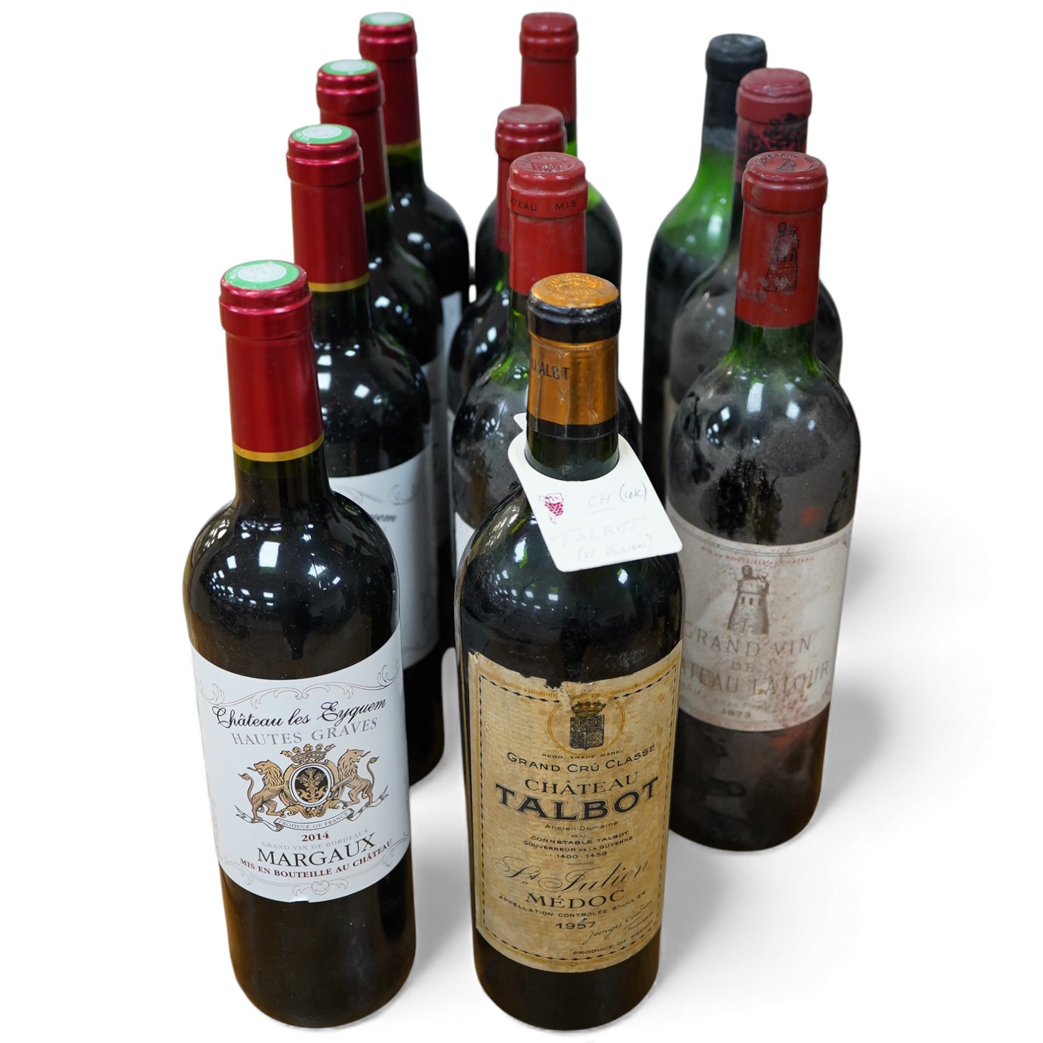 Eleven bottles of red wine including; Grand Vin du Chateau Latour 1973, Chateau Lafite Rothschild 1965, Chateau Talbot Medoc 1957, four bottles of Chateau les Eyquem Margaux 2014, two bottles of Chateau Cissac 1976, etc.